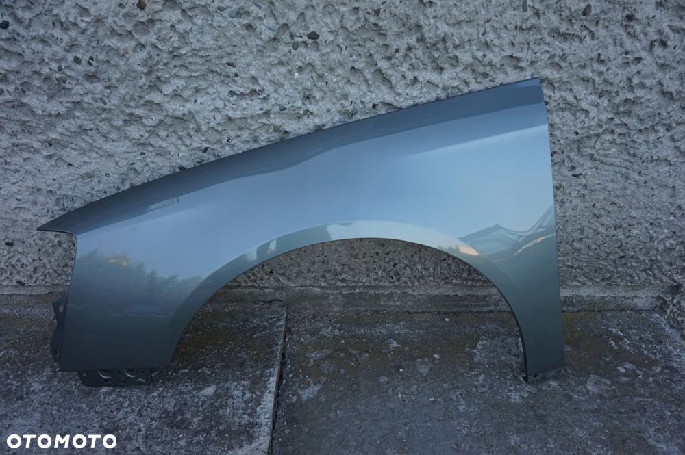 BŁOTNIK PRZEDNI LEWY VW PASSAT B6 LB5S