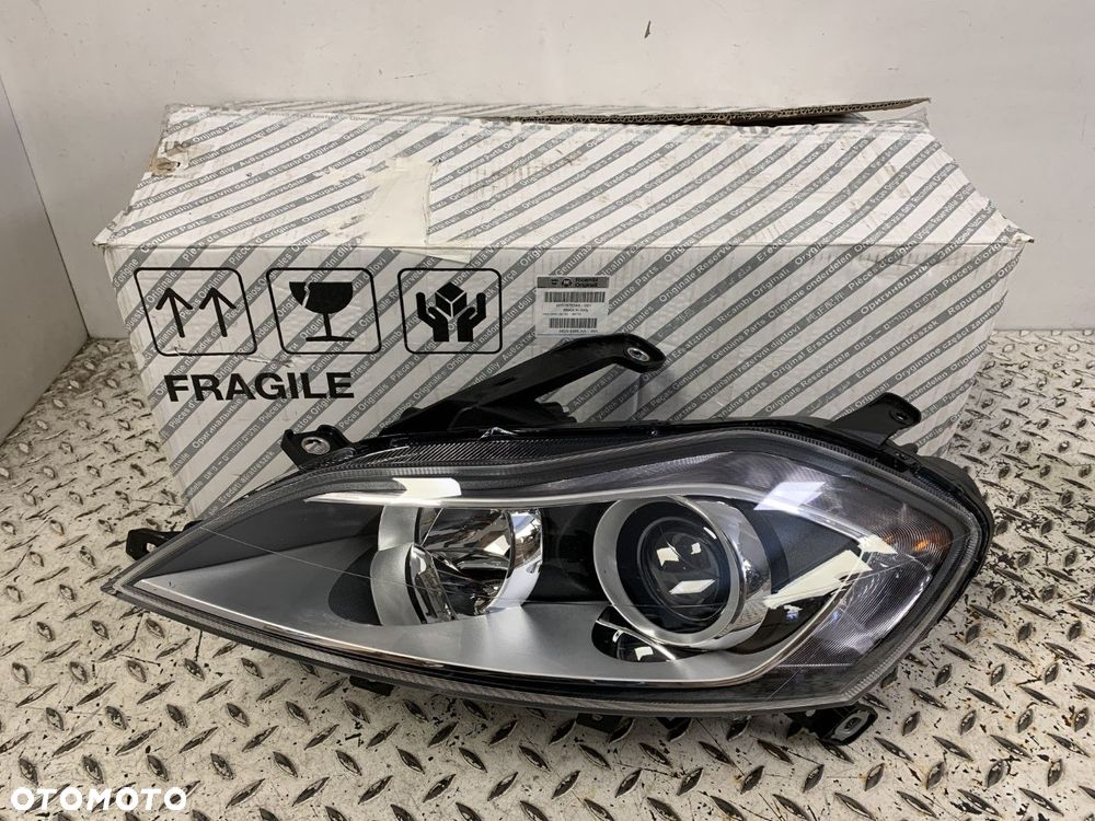 NOWA ORYGINALNA LAMPA LAMPA LEWA PRZEDNIA LEWY PRZÓD LANCIA DELTA 08-14 51876348 - 2