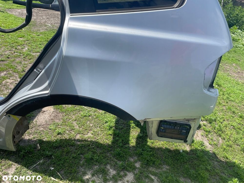 Blotnik cwiartka poszycie lewy tyl 354/7 TITANSILBER BMW X3 E83 100umFe - 5