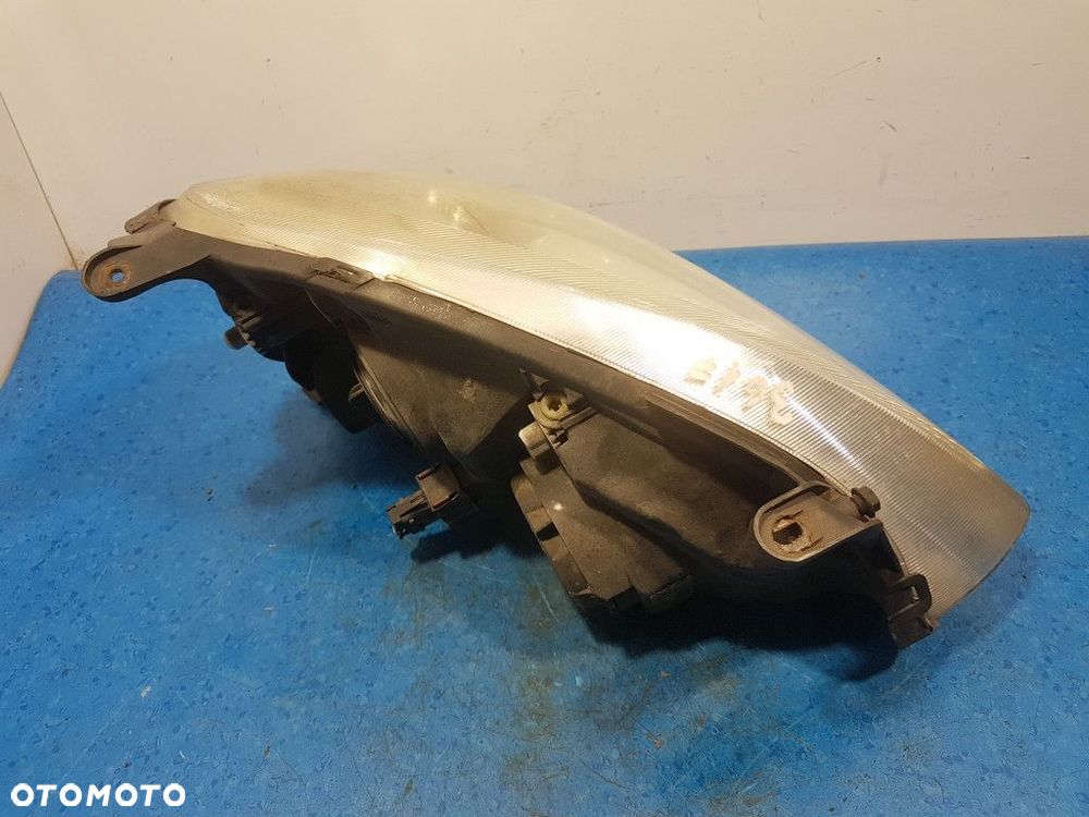 OPEL CORSA C REFLEKTOR LEWY - 7