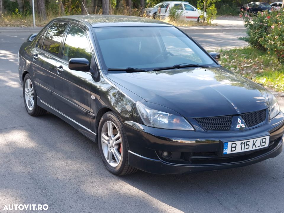 Dezmembrez Mitsubishi Lancer motor 2.0 benzina 135cp 4G63 navigatie subwoofer dezmembrari piese - 1