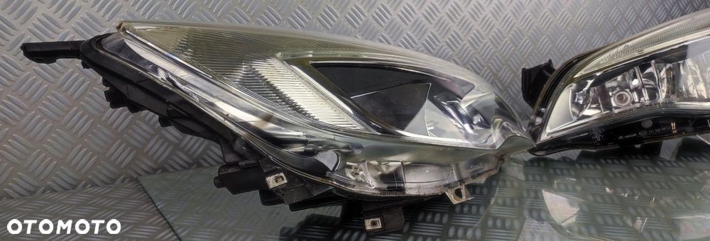 reflektor lampa lewa lewy prawa prawy przód przednia OPEL ASTRA J IV 4 EURO - 2