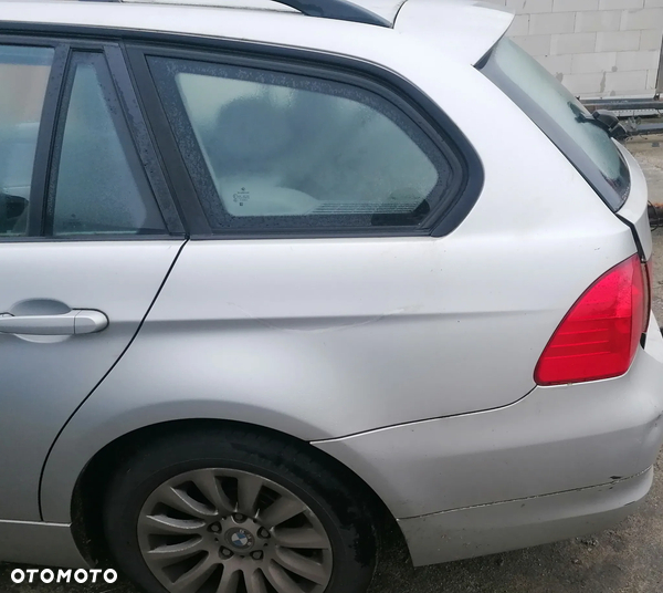 BMW SERII 3 E91 09r BŁOTNIK LEWY TYŁ 354/7