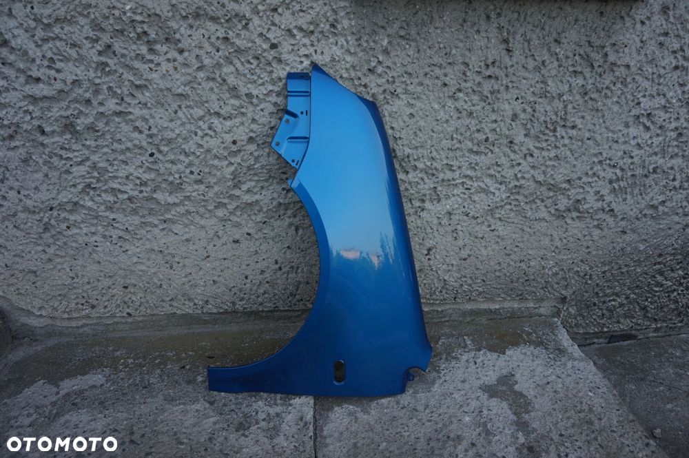 BŁOTNIK PRZÓD LEWY VW POLO 9N OKULAR LA5M 01/05r - 2