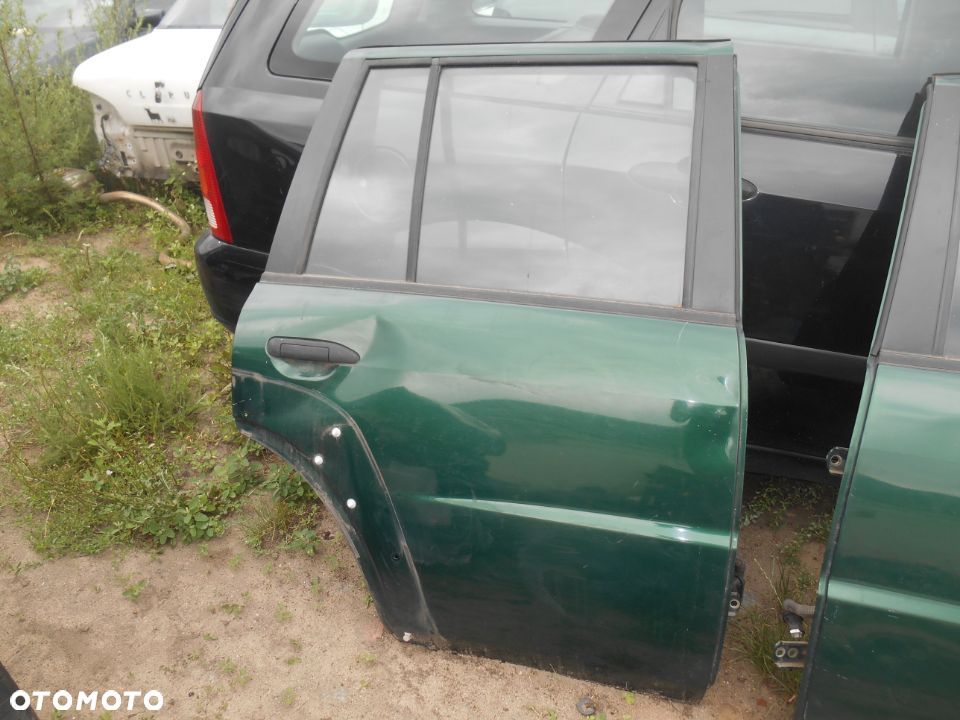 Drzwi prawe tył tylne Nissan Patrol Y61 lift GU4 3,0 Diesel - 1
