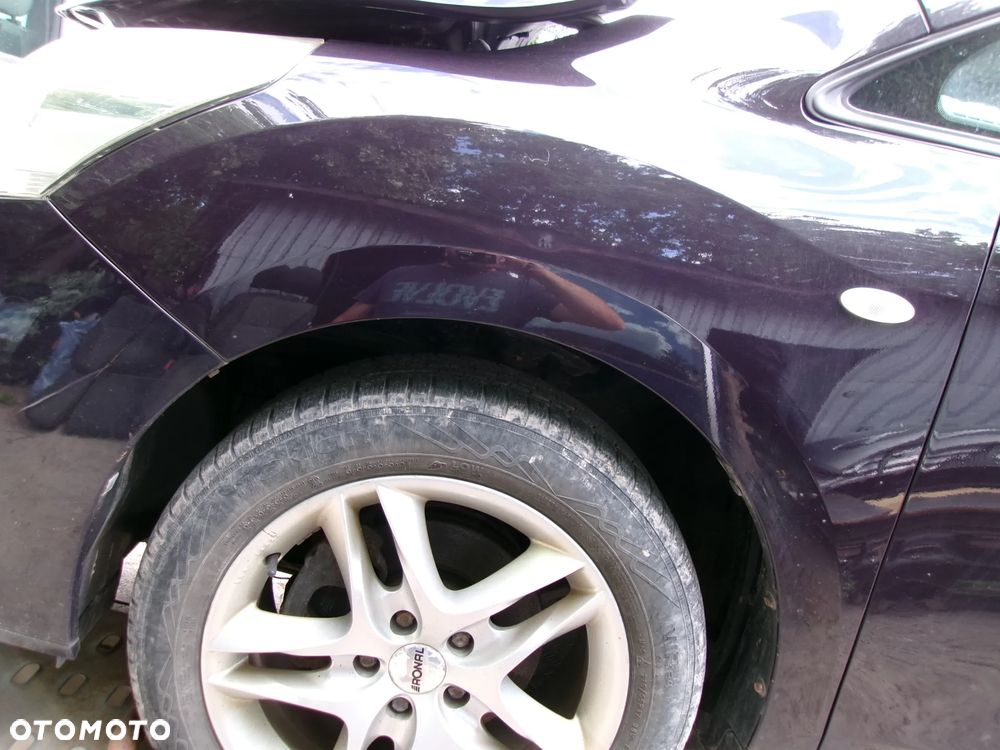 BŁOTNIK LEWY TOYOTA VERSO 09-13  9AK - 1
