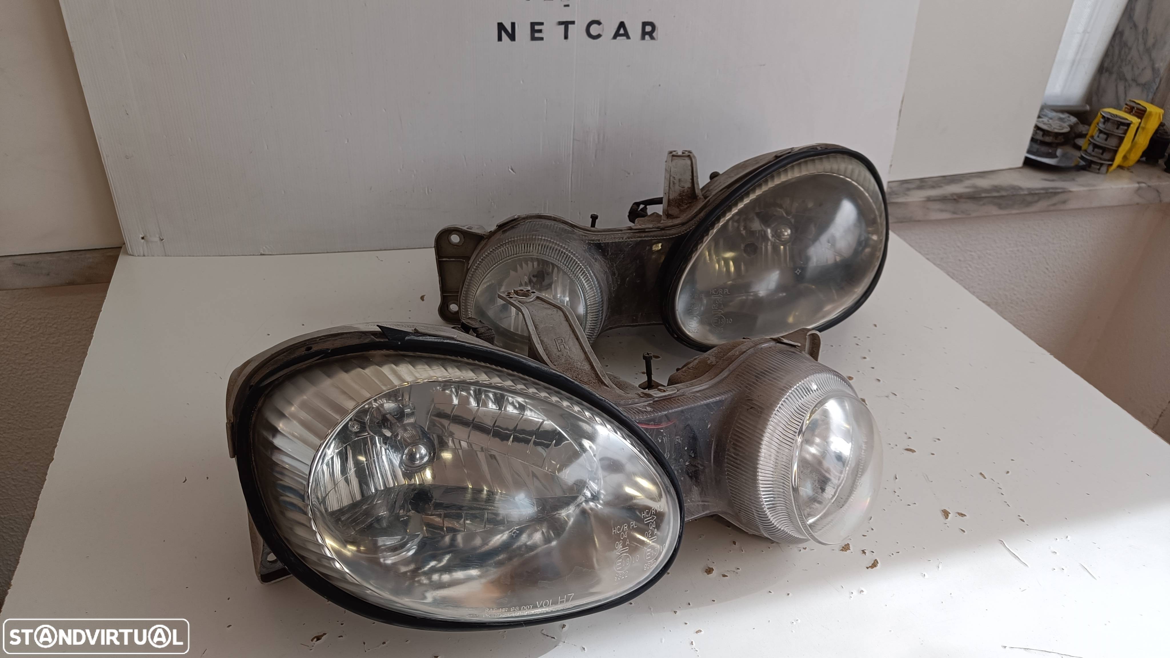 farol óptica Kia shuma 2000 - 2
