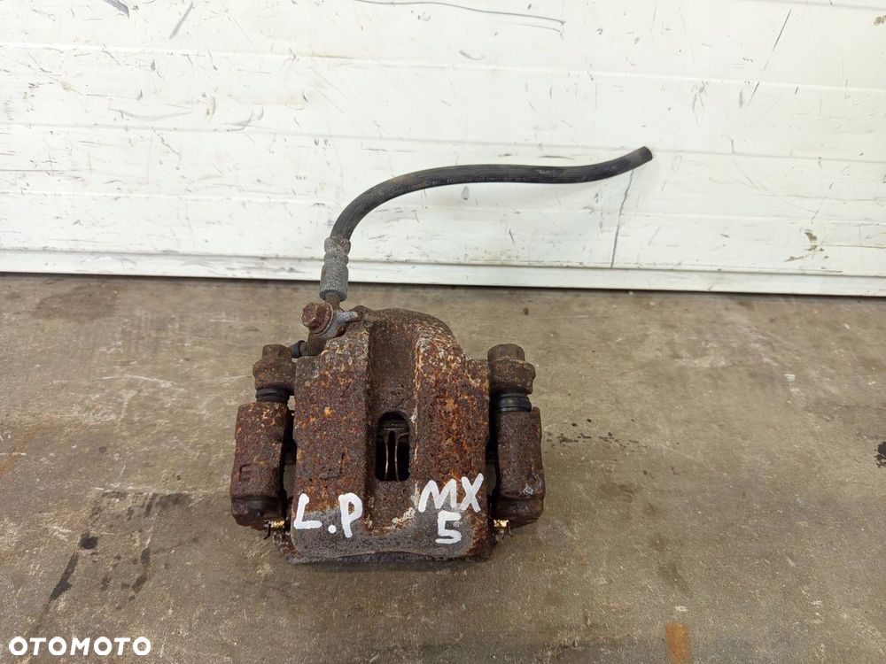 ZACISK LEWY PRZÓD LEWY PRZEDNI MAZDA MX5 MX-5 II NB