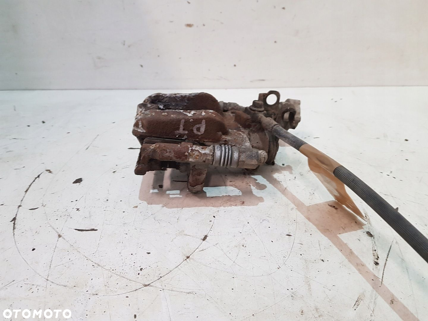 ZACISK HAMULCOWY PRAWY TYŁ OPEL ASTRA J EUR - 10