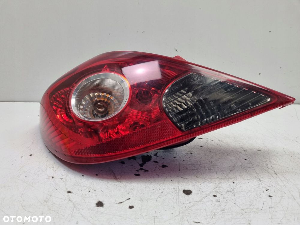 LAMPA TYLNIA LEWA Opel Corsa D 3D HTB 06-14r _ LEWY TYŁ 13211840 89038962 - 3