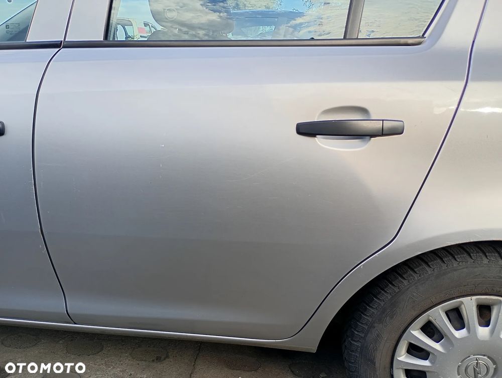 OPEL CORSA D 5d drzwi lewe tylne lewy tył Z157 srebrne - 2