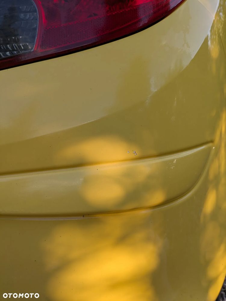 Opel Corsa 1.2 16V Enjoy - 23