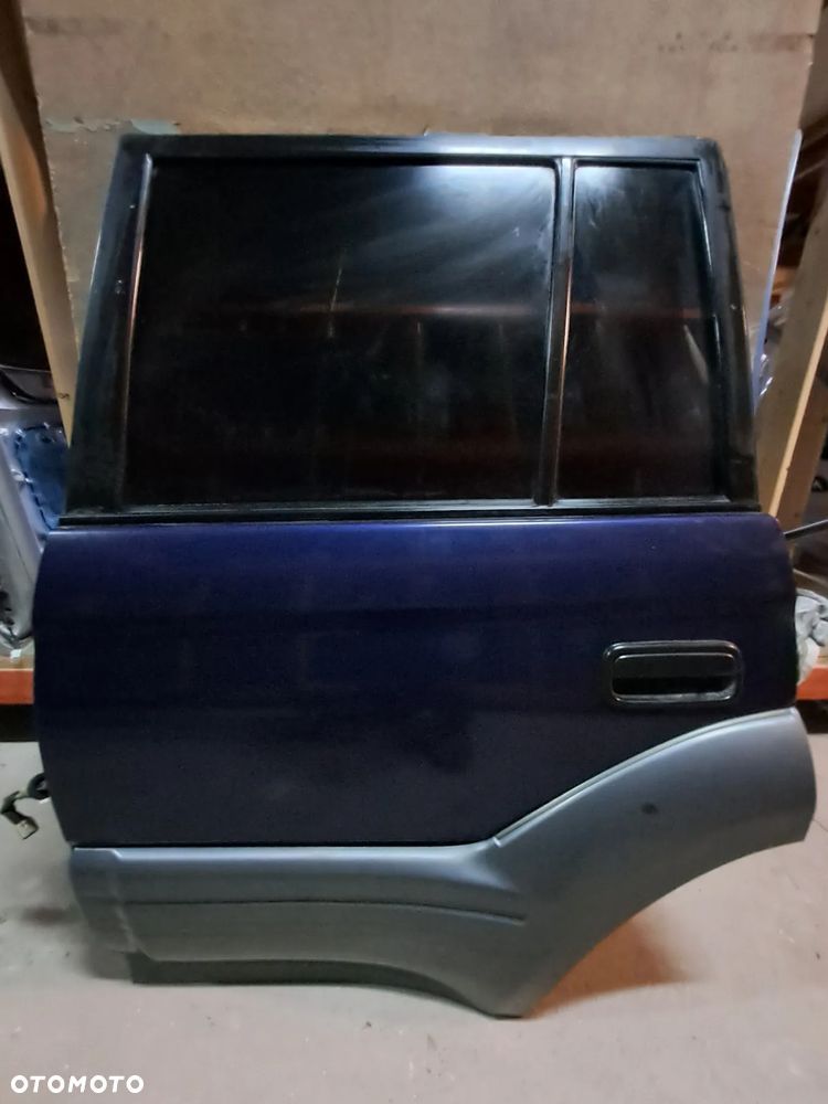 Drzwi Toyota Land Cruiser III 96-02' 90 KJ90 lewy tył (granatowe)