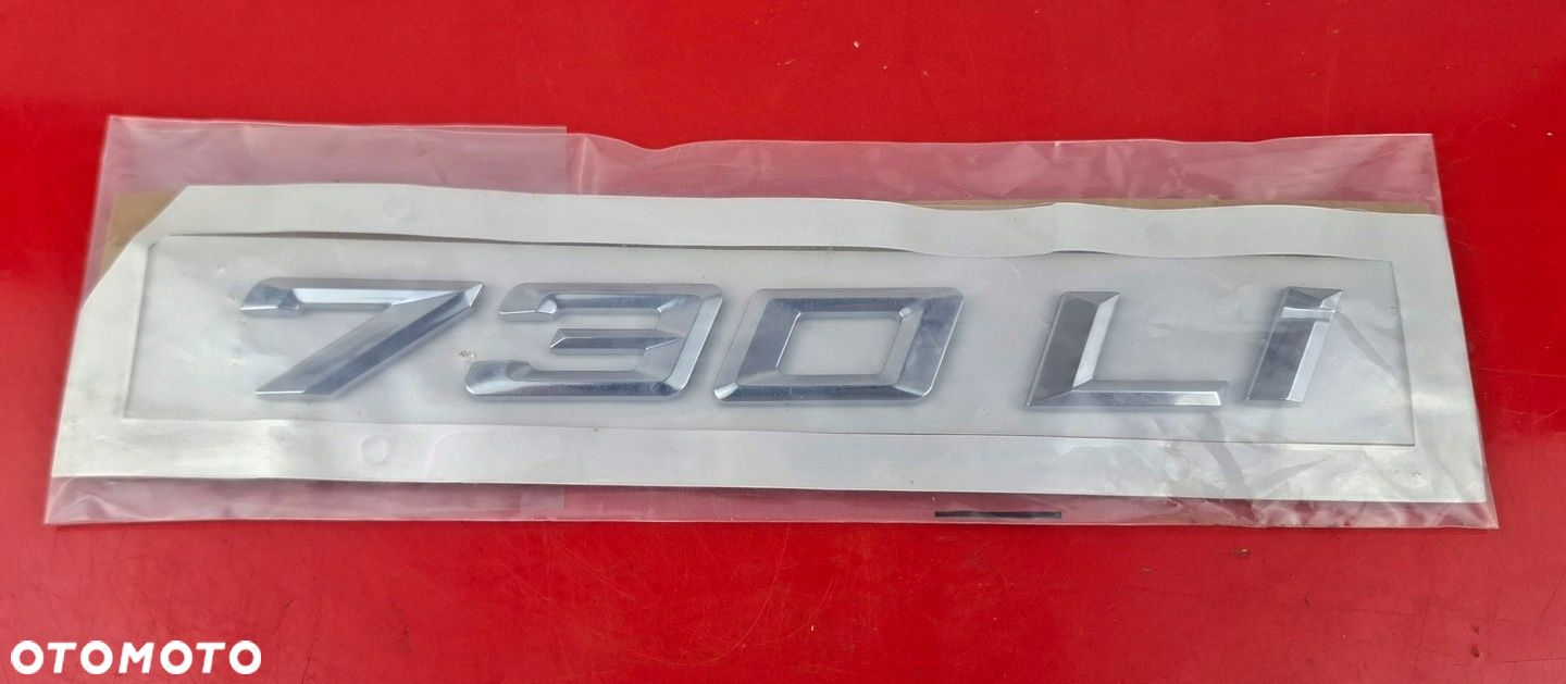 BMW OE Emblemat Znaczek tylnej klapy 730Li B400130134 1053394 - 1