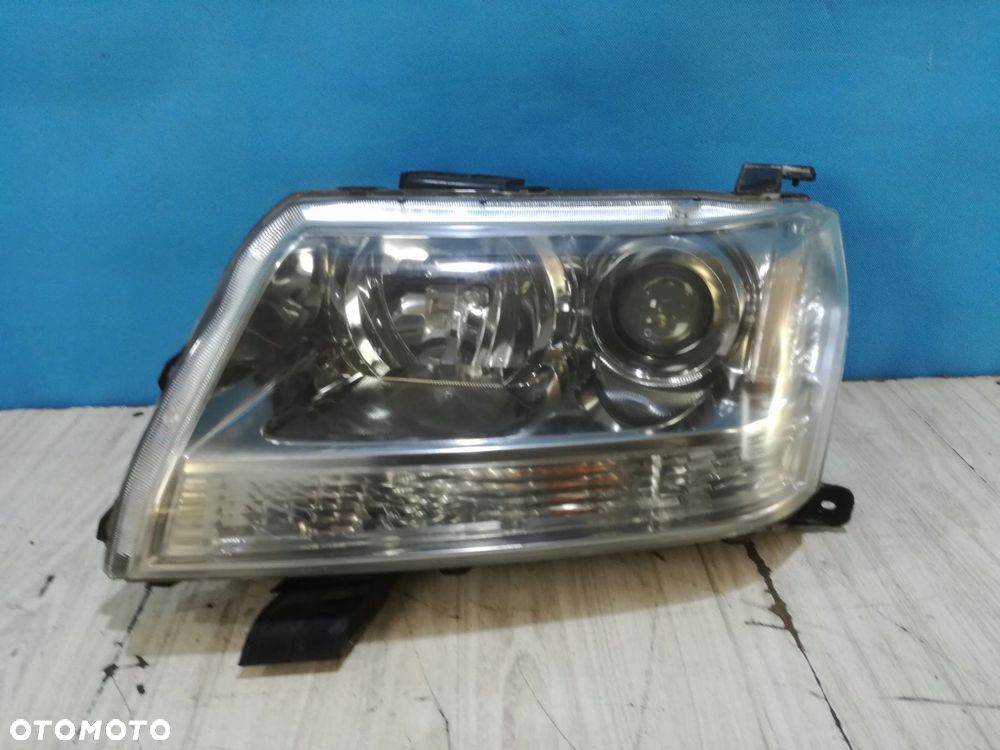 Suzuki Grand Vitara II lampa reflektor przód lewa soczewka 06/12 Anglik - 1