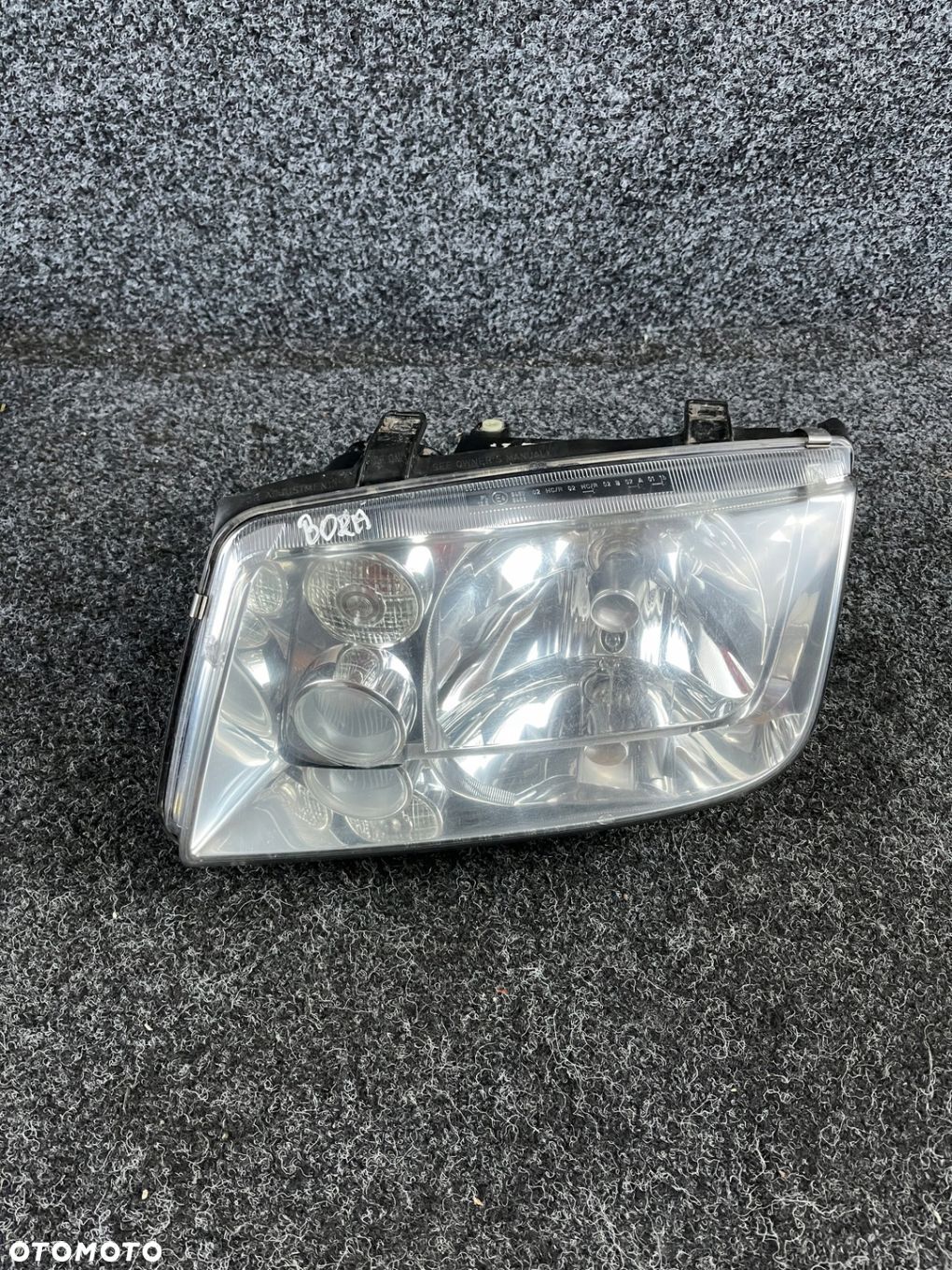 vw bora reflektor lampa lewy przód lewa przednia hella OE - 1