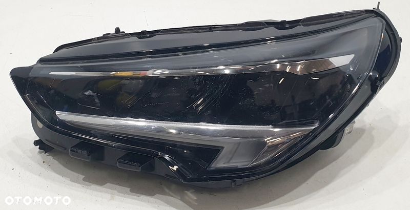 Opel Corsa Reflektor Lewy 9829522780