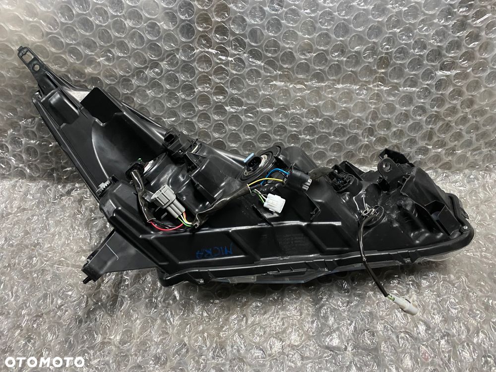 LAMPA LEWA ZWYKŁA CZARNA NISSAN MICRA K14 26060 5FA08 KOITO 100-18728 - 7