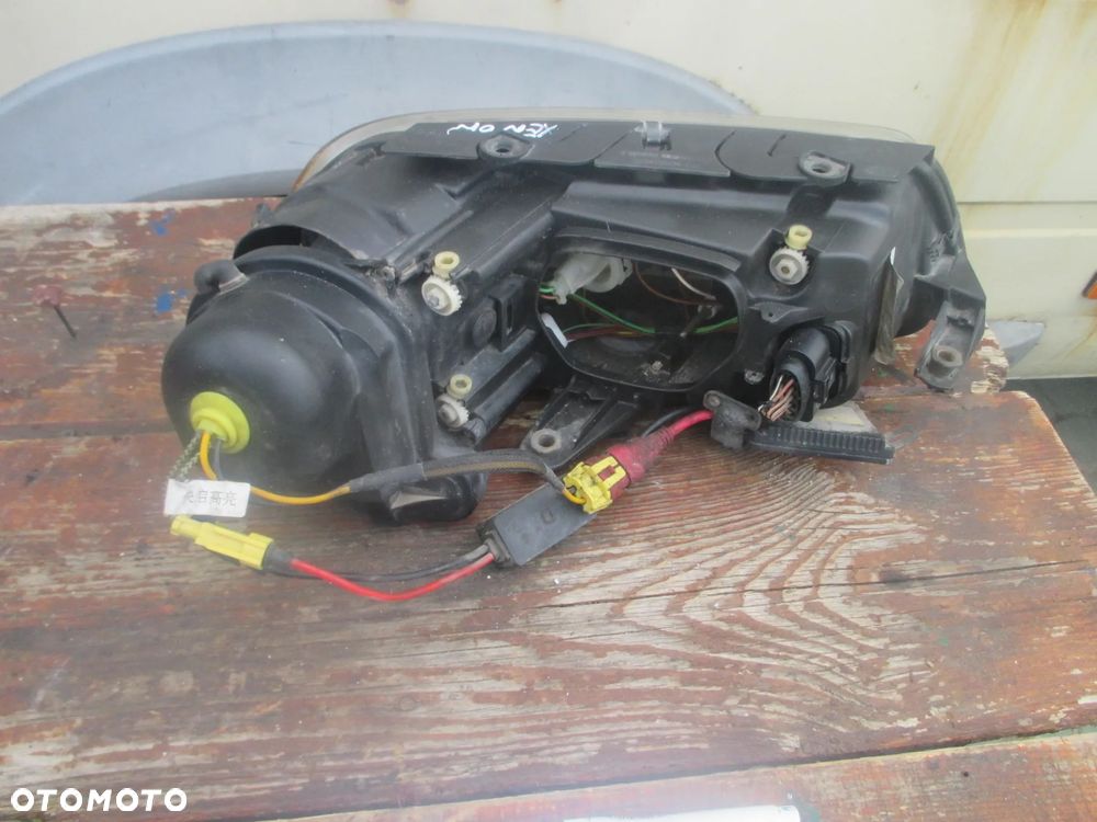 lampa lewa Passat B5 LIFT Xenon Hella Europa - 6