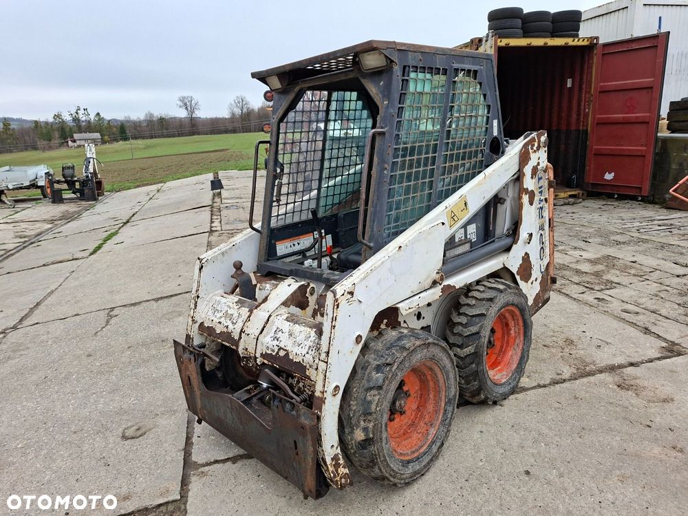 Bobcat 553 4X4 + Melroe Ingersoll-Rand 725S B/H - 1