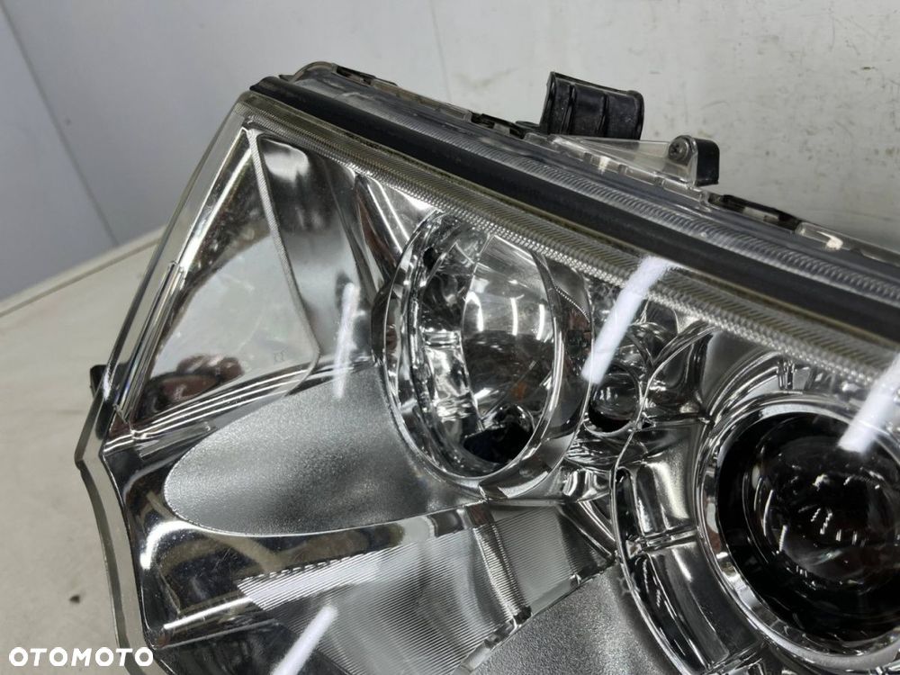 Lampa reflektor Mitsubishi L200 LIFT 10-15r. Pajero Sport II 03-16r. LEWA przednia soczewka EUROPA - 15