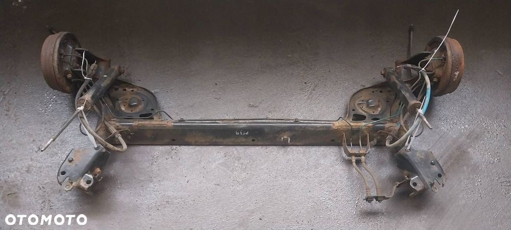 BELKA OŚ ZAWIESZENIA TYŁ BĘBNY Z ABS RENAULT CLIO III 1.5 DCI - 1