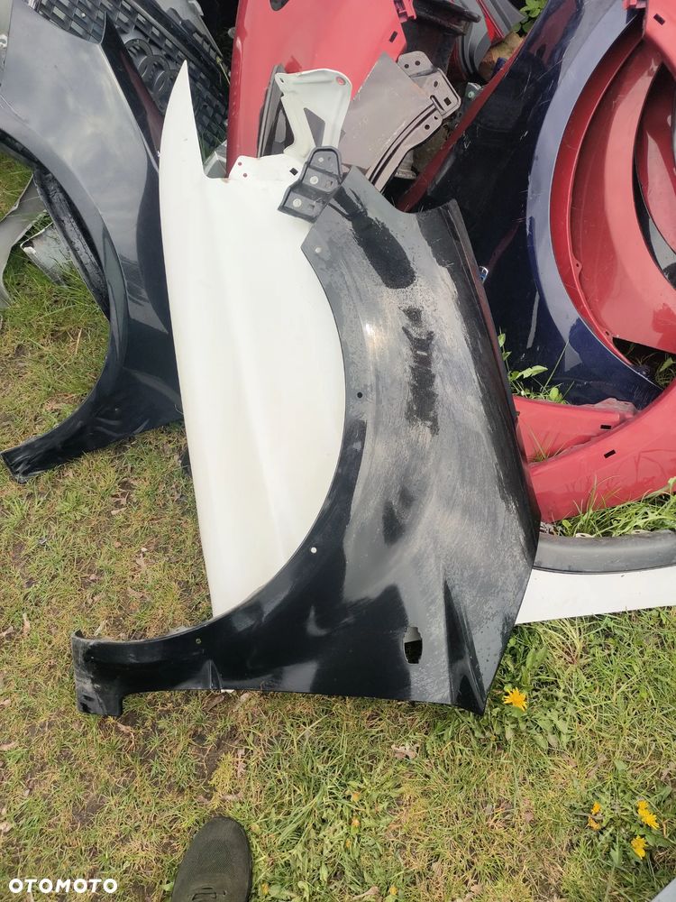 Suzuki SX4 błotnik przedni przód lewy