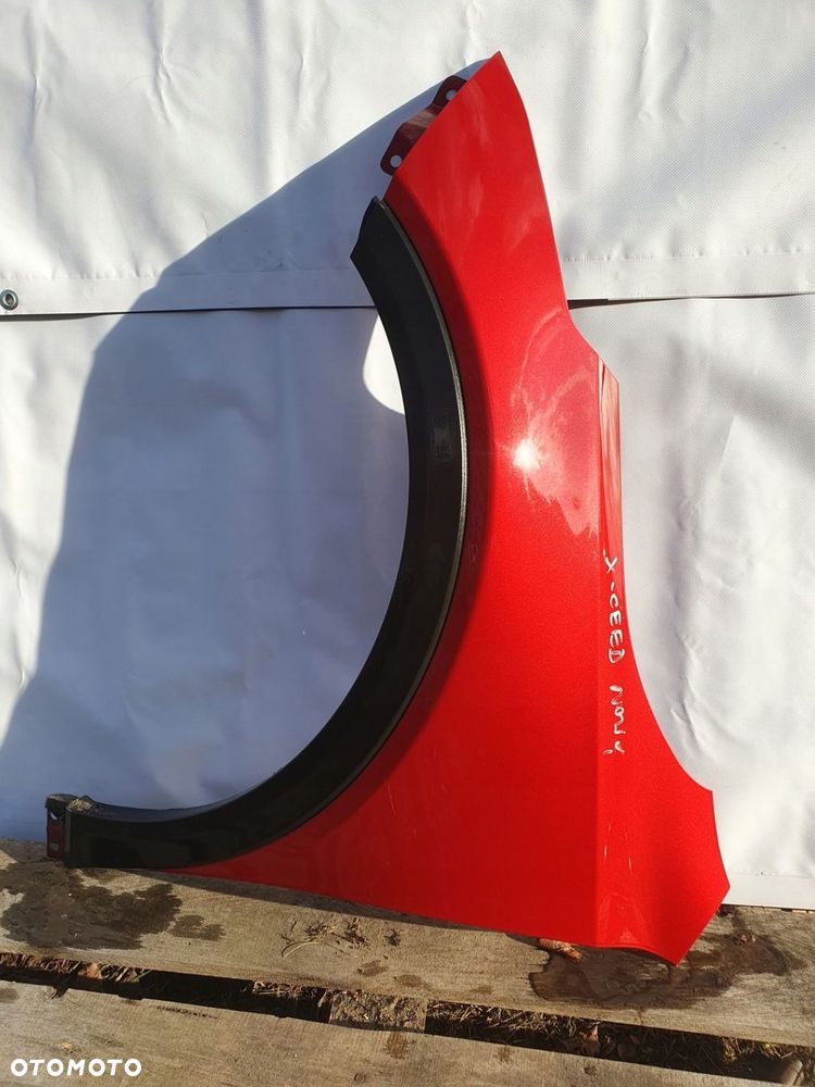 KIA X CEED XCEED BŁOTNIK LEWY PRZOD Z SIERPEM - 1