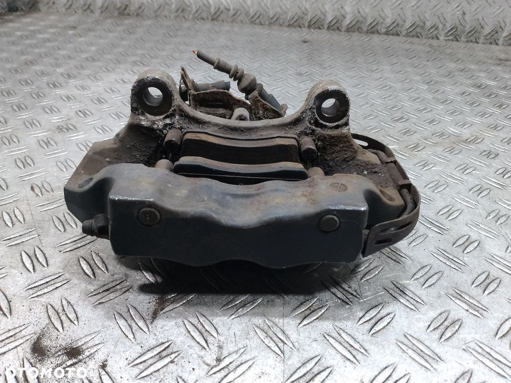 ZACISK HAMULCOWY LEWY TYŁ AUDI Q7 207673038 3.0 TDI - 2