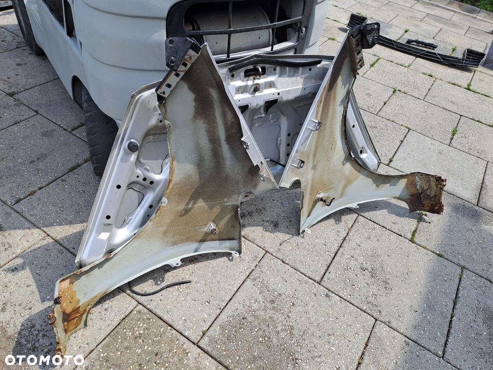 Mitsubishi Colt Z30 VI błotniki kod lakieru 21H - 27