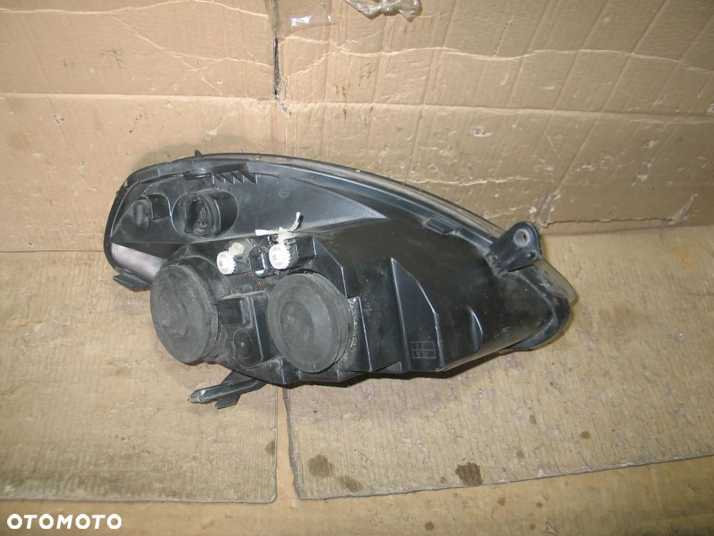 lampa przod lancia ypsilon 2 II lift 06-11r. oryginal europa - 10
