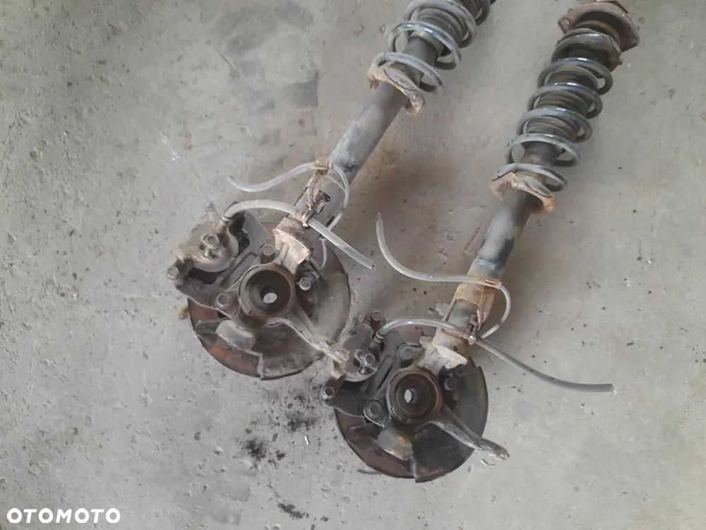 Amortyzator zwrotnica Macpherson Lewy prawy przod Justy IV 4 Sirion II 1.0b - 6