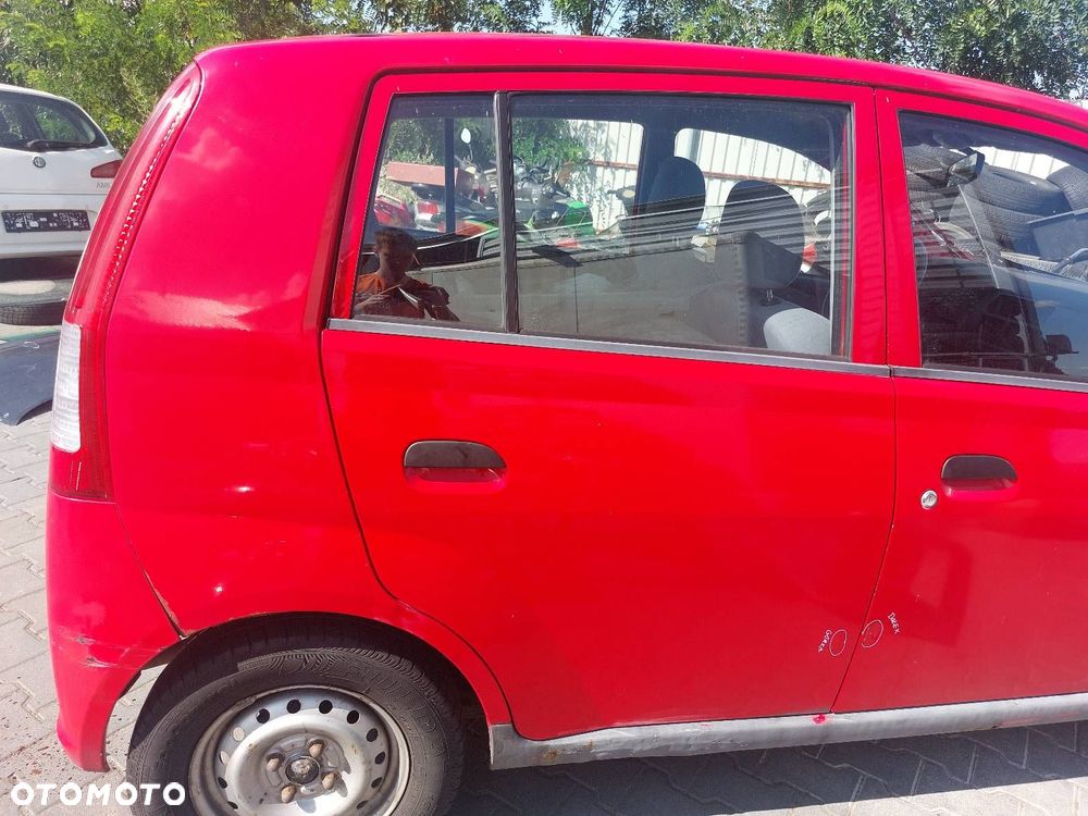 DRZWI KOMPLETNE PRAWY TYŁ DAIHATSU CUORE VI R29 - 1