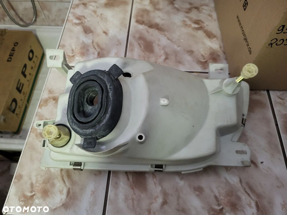 Reflektor Lewy lampa  (H4, elektryczny, bez silnika, kolor wkładu: srebrny  FORD TRANSIT IV FL, TRANSIT IV FL II 01.91-07.00 - 2