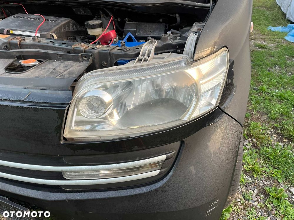 lampa przód przednia lewa daihatsu materia 2006 - 2011 europa cała