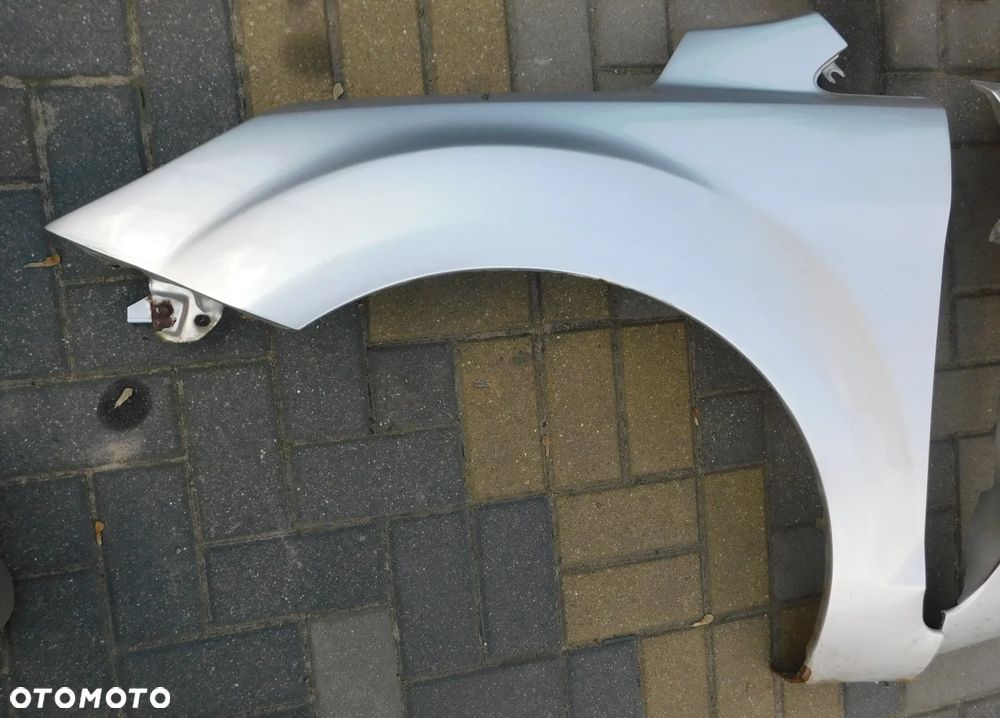 błotnik lewy przód FORD FOCUS II LIFT FL  03