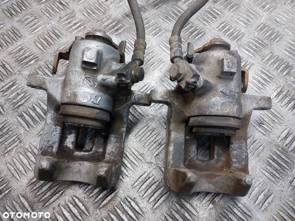 TARCZE HAMULCOWE TYŁ + KLOCKI + ZACISKI AUDI A4 B7 2.0 TDI - 10