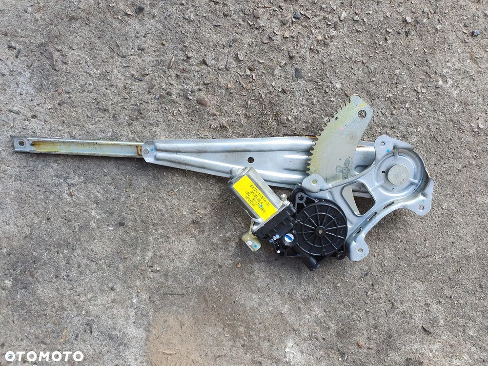 PODNOŚNIK LEWY TYŁ NISSAN NOTE E12 1.2 2015r ORYGINAŁ EUROPA