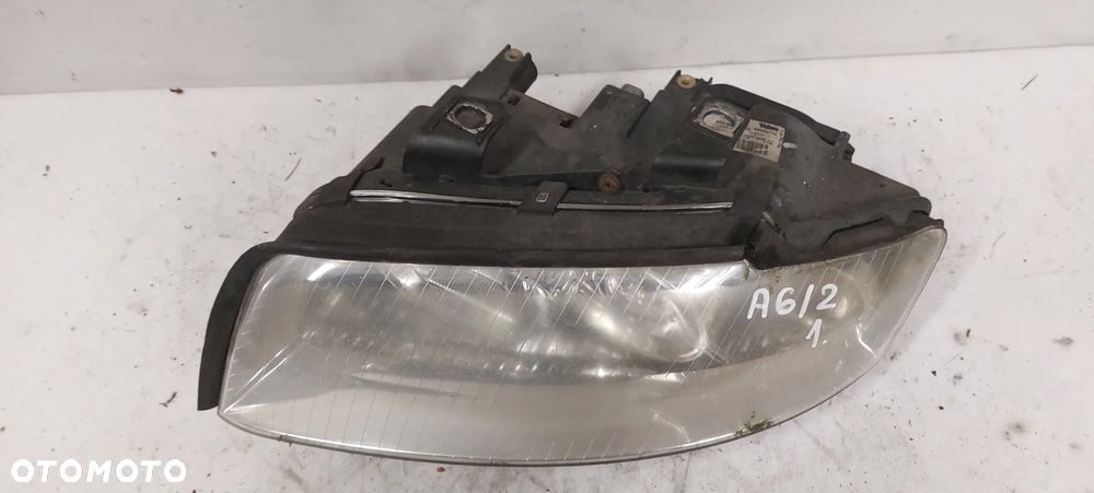 .  LAMPA PRZOD PRZEDNIA LEWA AUDI A4 B6 - 2