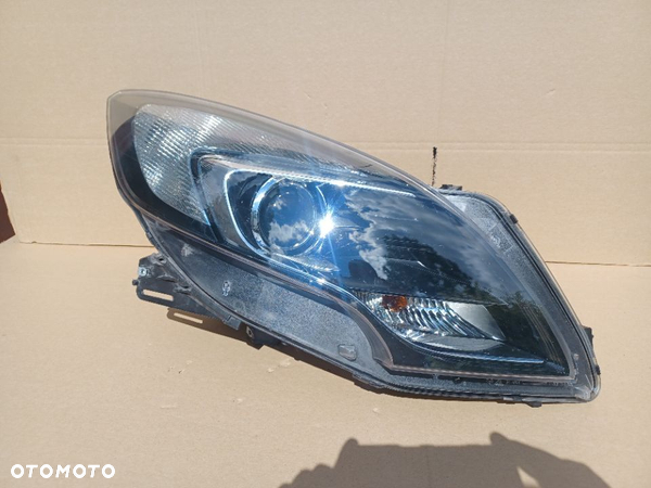 Lampa przednia prawa soczewka Opel Zafira B Tourer oryg