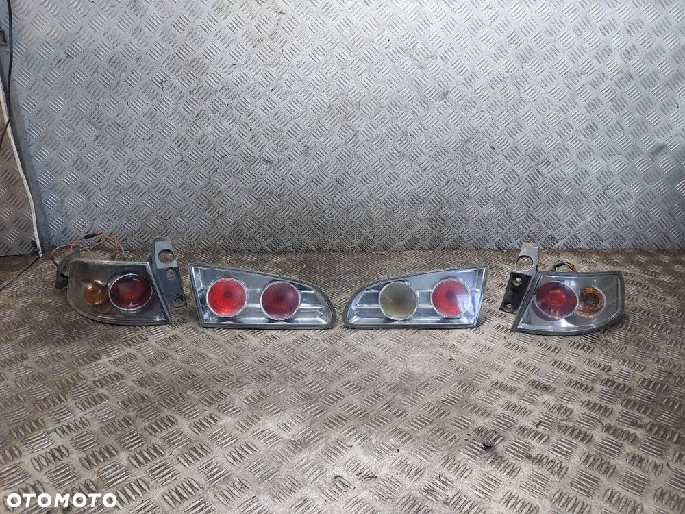 LAMPA LEWY TYŁ PRAWY TYŁ W BŁOTNIK W KLAPĘ SONAR SEAT IBIZA III ID: 237472 - 1