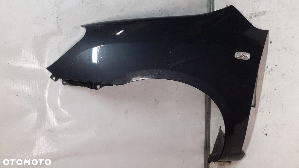 * KIA CARENS 3 III  BŁOTNIK PRZÓD LEWY SZARY 1U - 1