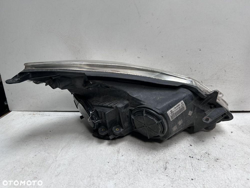 Reflektor lewy Opel Corsa D 13186381 - 2