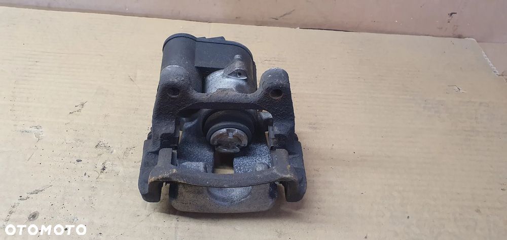 Zacisk hamulcowy lewy tył tylny lewy VW Passat B6 - 7