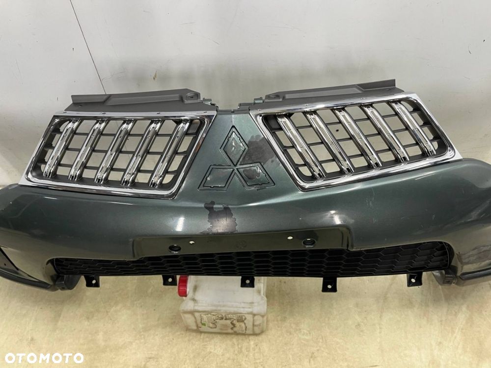 Zderzak przedni Mitsubishi Pajero Sport 2 II L200 4 IV 10-15r. Lift przód 6400D164 - 6