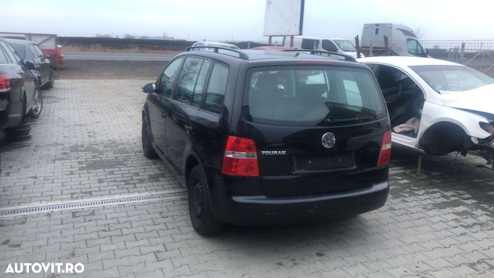 Dezmembram Volkswagen Touran 1.6 benzina an fabr 2006 - 1