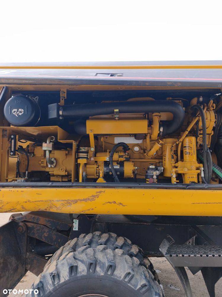 Caterpillar M318 - 6