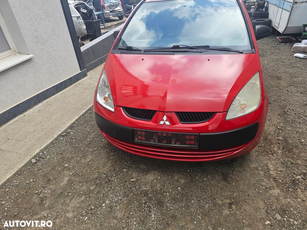 Dezmembrez Mitsubishi Colt CZ3 1.1 benzina an 2006 volan stanga