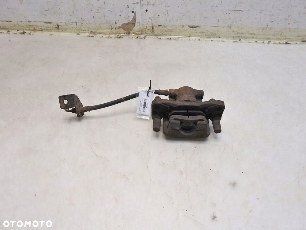 ZACISK HAMULCOWY PRAWY TYŁ MITSUBISHI LANCER VIII 1.8 - 6