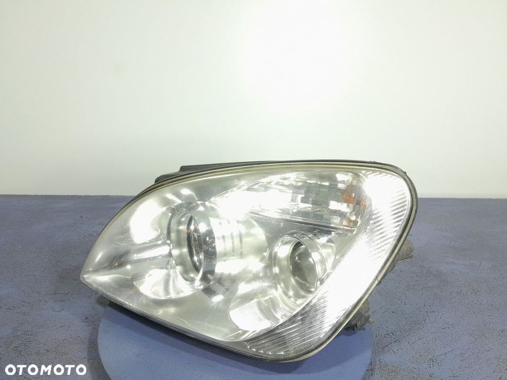KIA CARENS III REFLEKTOR LAMPA PRZÓD LEWY EU - 2